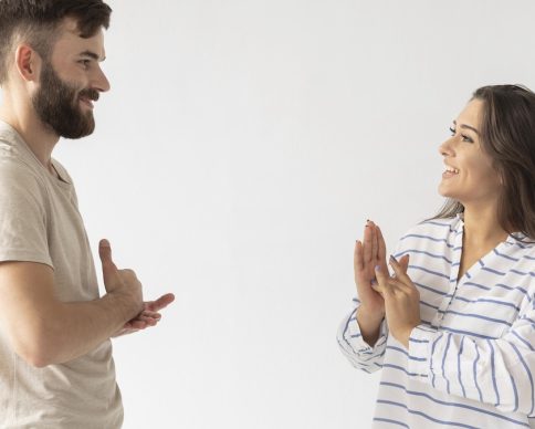 casual-man-woman-communicating-through-sign-language