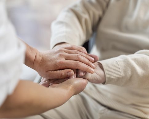 doctor-holding-hands-with-senior-patient