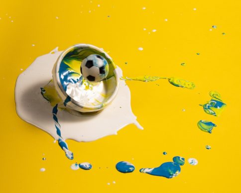 high-angle-decoration-with-yellow-paint-soccer-ball