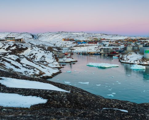 ILULISSAT, DENMARK - May 08, 2014: Pink morning light at Ilulissat harbor, Greenland.