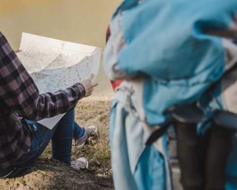 rear-view-hiker-with-map