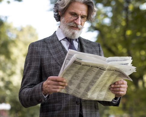 stylish-mature-male-reading-newspaper