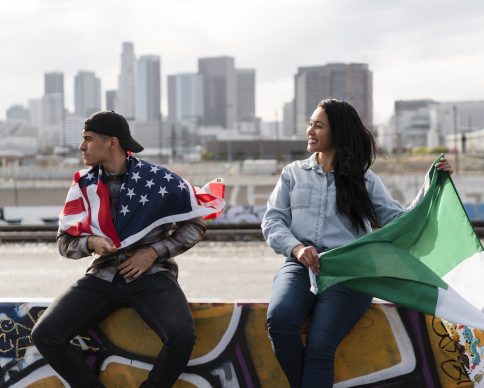 young-couple-with-flags-river